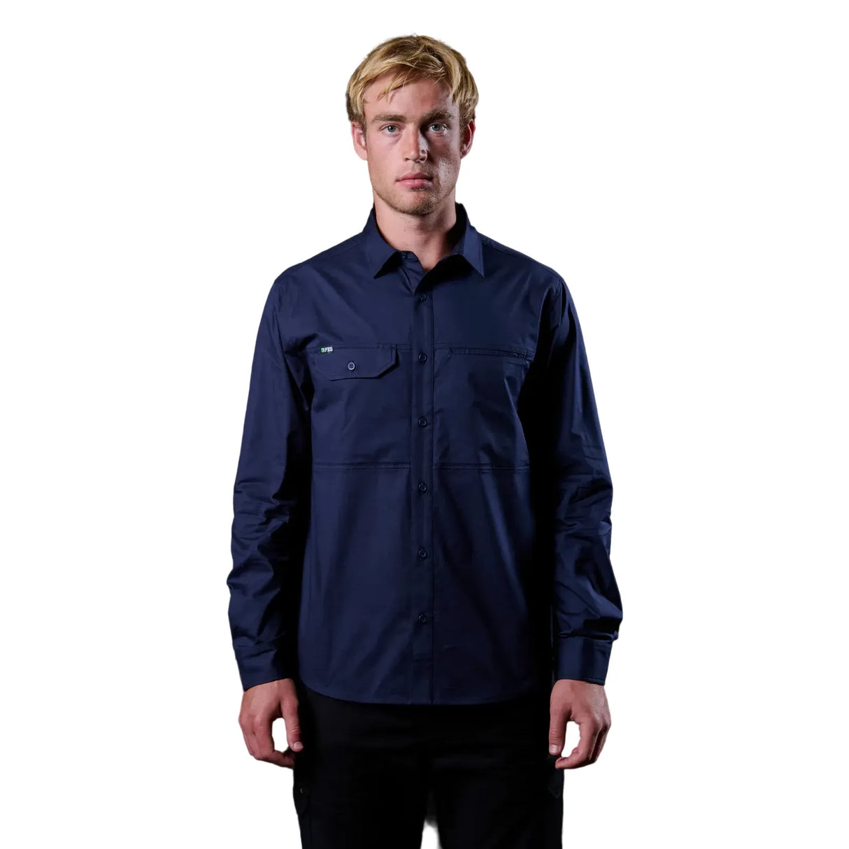 Man wearing a navy blue shirt against a black background